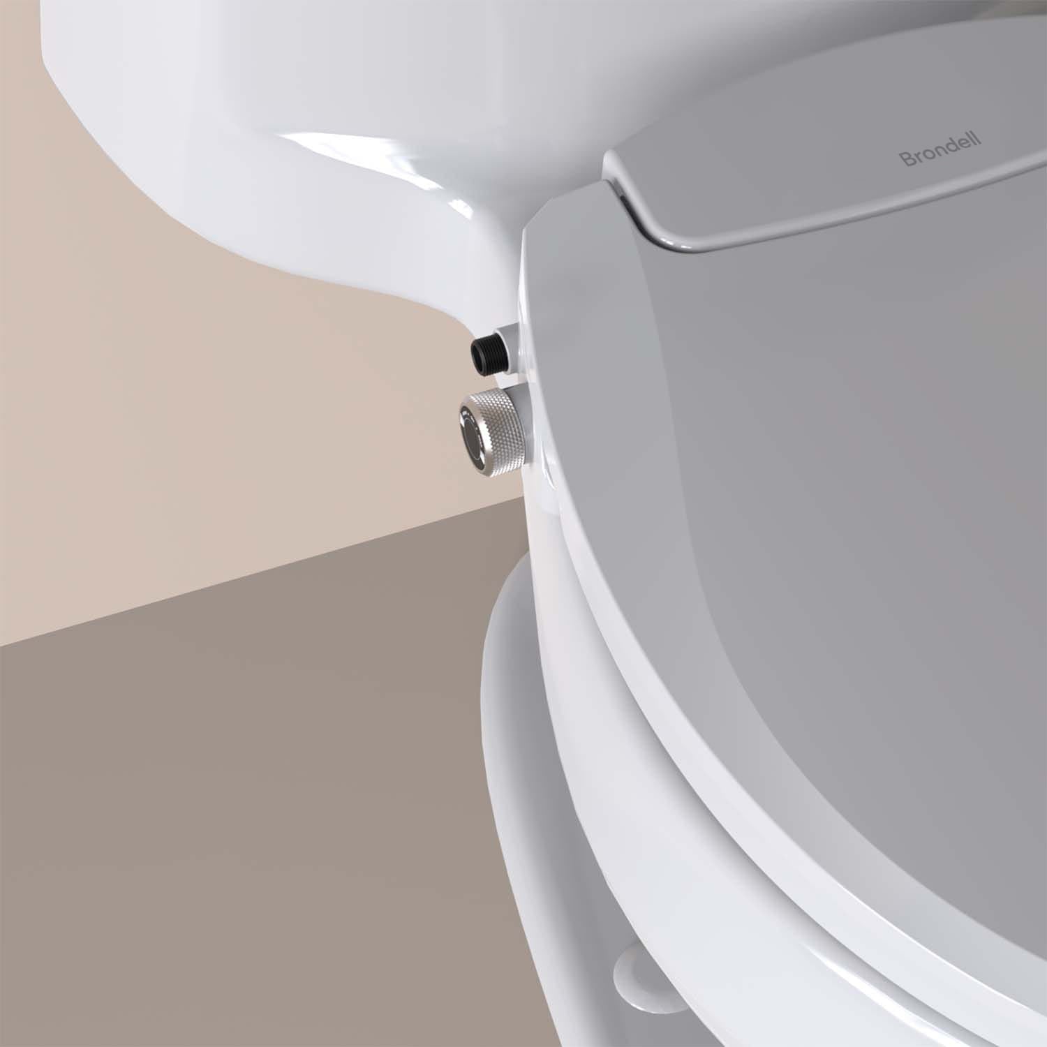 Close-up of Brondell Swash Ecoseat Non-Electric Bidet Seat knobs with a brand logo on a beige background