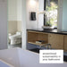 Modern bathroom with a sink, mirror, and window, featuring text 'streamlined sustainability in your bathroom'. Brondell Swash Thinline T22 electric bidet shown installed in toilet room.